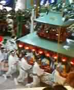 Okunchi festival, Nagasaki.&nbsp; Huge replica boats/floats are pushed up and down the crowded, narrow streets at incredibly dangerous speeds.