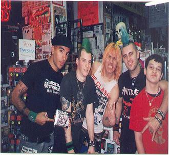 john acting tuff as the casualties try selling cds in his pic