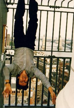 Dave upsine down on top of the Memorial for the great fire