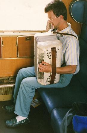  People entertain themselves anyway they can in the train