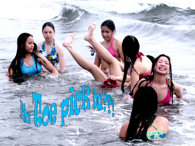 Falling over on the back against the waves of the sea in Nasugbu. Batangas is definitely not due to hitting your toe on the sand!