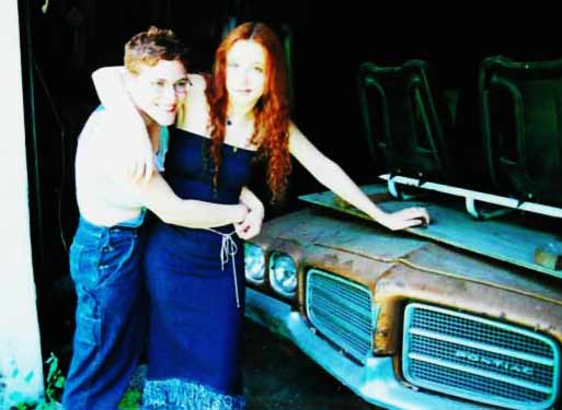 Laurie and Felix posing on the old Pontiac. 