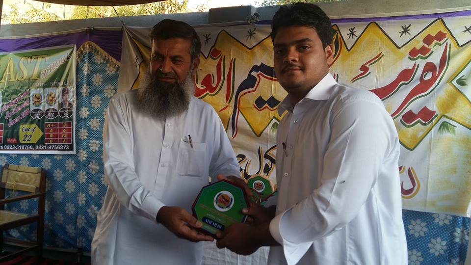 A Student getting Prize from Sir Abd Munsif