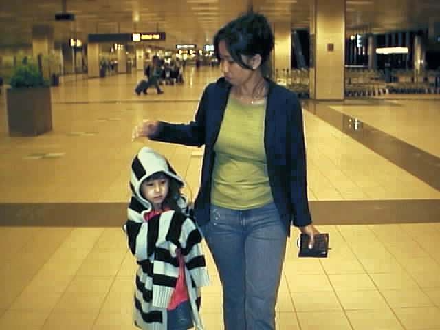 may n mama.we were at da airport at 1 in da morn n may was cold so she used mine.haha.its too big fer her as u can see