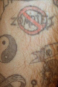 This is a "No Zombiez" tat that is on my upper left forearm. You can also see the Yin-Yang symbol as well as the infinity symbol.