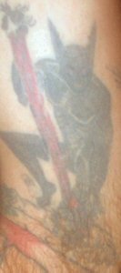 This is a tat of my doppleganger O.N., he is depicted pouncing on a wealthy business man and tearing the flesh from his head. 