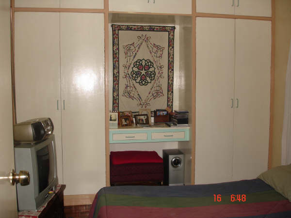This bedroom is behind the terrace.