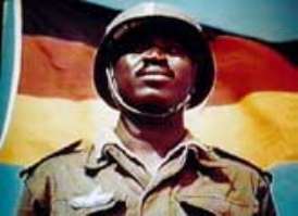 [Neger vor BRD-Flagge]