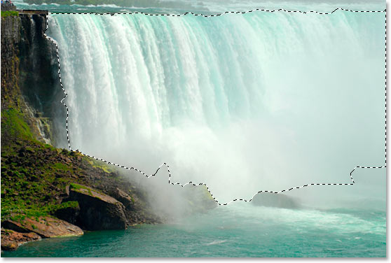 Description: Using the Lasso tool to drag a selection around the waterfall.