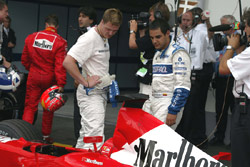 Ralf and Montoya check out the Ferrari 
