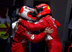 Barrichello and Schumacher hug 