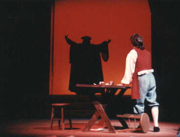 Mozart is haunted by the ghost of his father, Leopold, in a production of the play during TheatreTuscaloosa's 1990-91 Season.