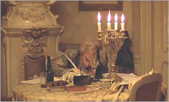 Deeply in debt, alcoholic, and in poor health, Mozart (Hulce) works on "The Requiem" late into the night.