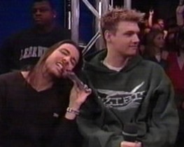 Nick smiles calmly as Howie demonstrates what he'll do to anyone who tries to come near his man.