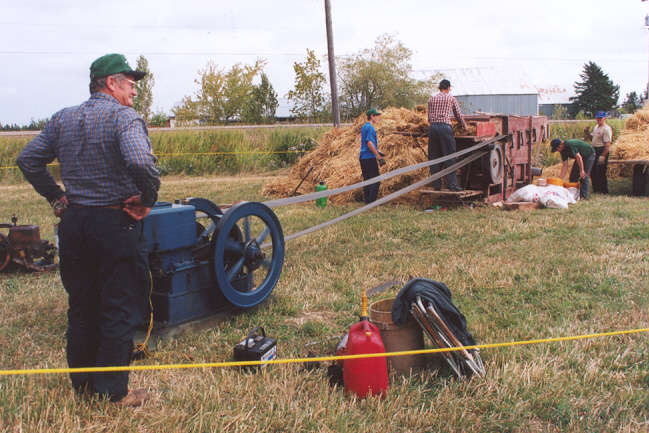 Stan and his engine running a thresher