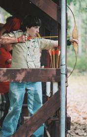 Picture of Scout ready with his bow at Archery Range