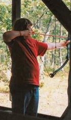 Picture of Scout ready with his bow at Archery Range