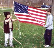 Image of Two Scouts Raising Flag