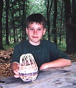 Image of Scout with Basketweaving Work