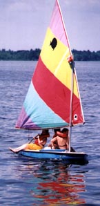Image of Scouts in Small Sail Boat