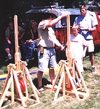 Image of Scout Leader demonstrating a trebuchet