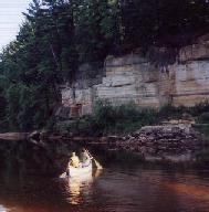 Image of two Scouts canoeing