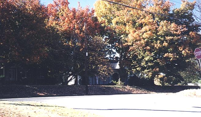 On South Main Street, another old Victorian home nestles among trees of varying hues.