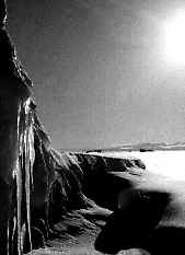 Jagged crags and gaping cracks in near-shore sea ice.