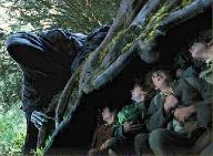 The Black Rider and the hobbits hiding