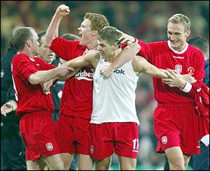 Stevie G celebrates our first goal with Danny, Johnny and Sami, scored skillfully/flukily with a very helpful deflection off Becks.