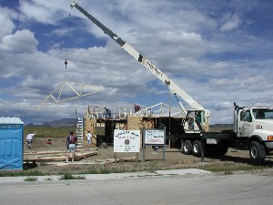Trusses lifted by 'cherry picker' 