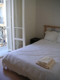 The bright and airy bedroom with its own balcony