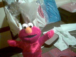Elmo puts his hand in, Elmo puts his hand out ...