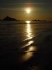 Description of Stock Photo: The sun, low over the horizon, reflecting off the ocean. Pebble Beach, Crescent City, California.