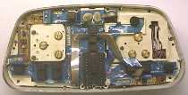 The back of the instrument cluster, with the rear cover removed, early model.