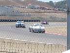 Corvette following a Mustang on turn 3