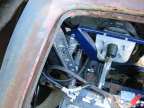 Rear end mounted master cylinder and battery