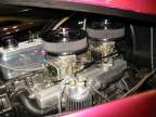 Dual Holley one barrals with clear float bowls atop an Offenhauser intake