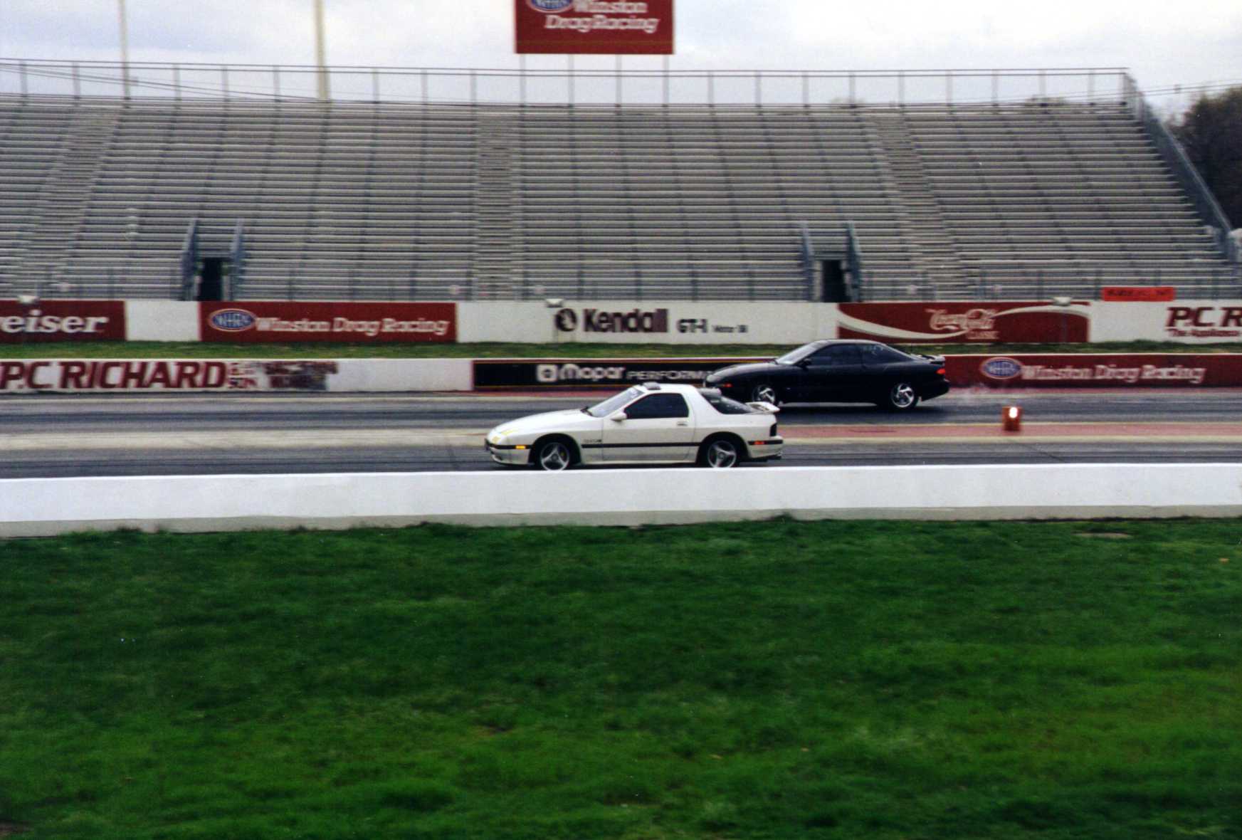 RX-7 leaving a Probe GT
