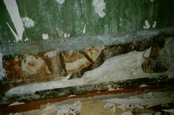 Right hand wall from
entering far side door.