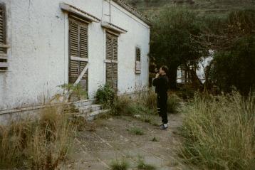 Frater Paulos standing
before the front of the abandoned Abbey of Thelema.