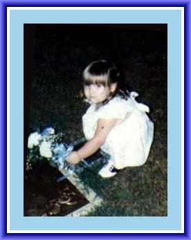 Gina Putting Flowers on Kyle�s Grave