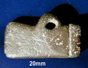 Bronze axe, These were known as votive offerings as they were often used at burials
 or thrown into streams as offerings to the Gods. This is a miniature axe but other tools are commonly found.
Votive offerings (a.k.a. votives and ex-votos) are actions or material things vowed to God (or promised to a Saint) in return for a hoped-for miracle. Technically, such a gift is known as a votive offering. Votum is the past participle of the Latin verb vovere, 'to vow