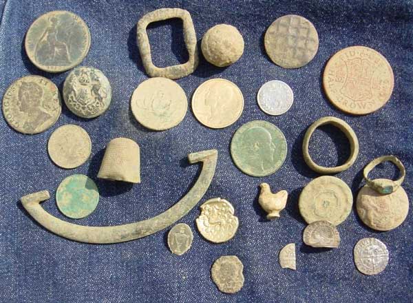 buckles and some old copper coins, buttons, Roman ring, hammered coins, Roman coin , thimble, halfcrown, and an old chicken