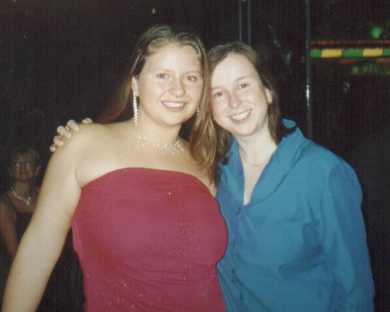 me and my mom, by the way my dress is actually bright red, but the lights made it look funny!