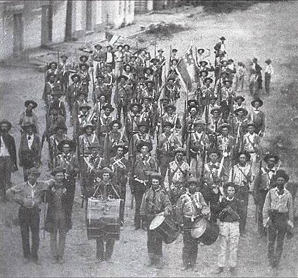 Company H, the Hempstead County Rifles of the 3rd Arkansas Infantry, photographed in Arkadelphis, Arkansas, in June 1861.  Regimental commander was John R. Gratiot.  Armed with a mix of weapons, this regiment was severely damaged in its only battle at Wilson's Creek, after which it was reorganized and redesignated.  From Blue & Gray, Special Issue Wilson's Creek, October 1996, p. 14.  Original source: General Sweeny Museum, Republic, Missouri.