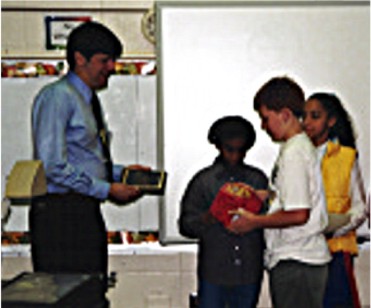 RSC Team Members present a plaque and gift to Mr. Adamo.