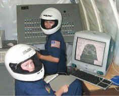 Jason and Erin take a short break during training.  MacSPOC is running on the computer.