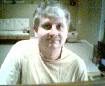Scott in gold T-shirt