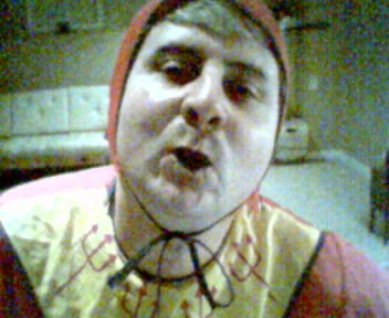 Me in my devil outfit with black lipstick on, puckering lips